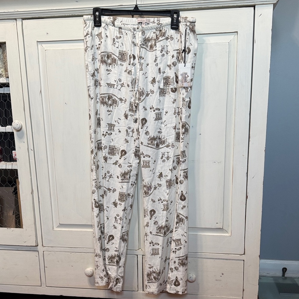 Sincerely Jules White Pants with Brown City Print. Low Rise Flare